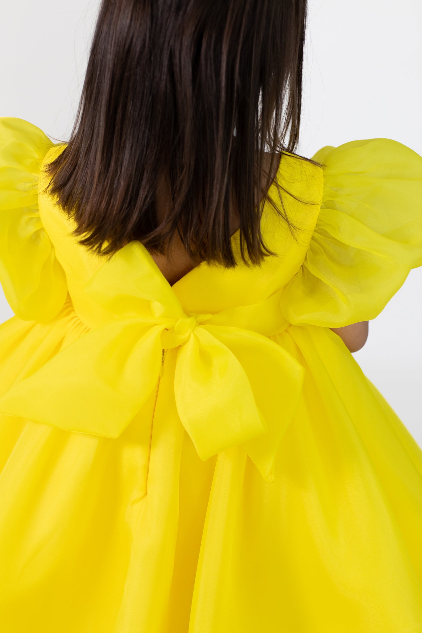 Yellow organza dress with puff sleeves